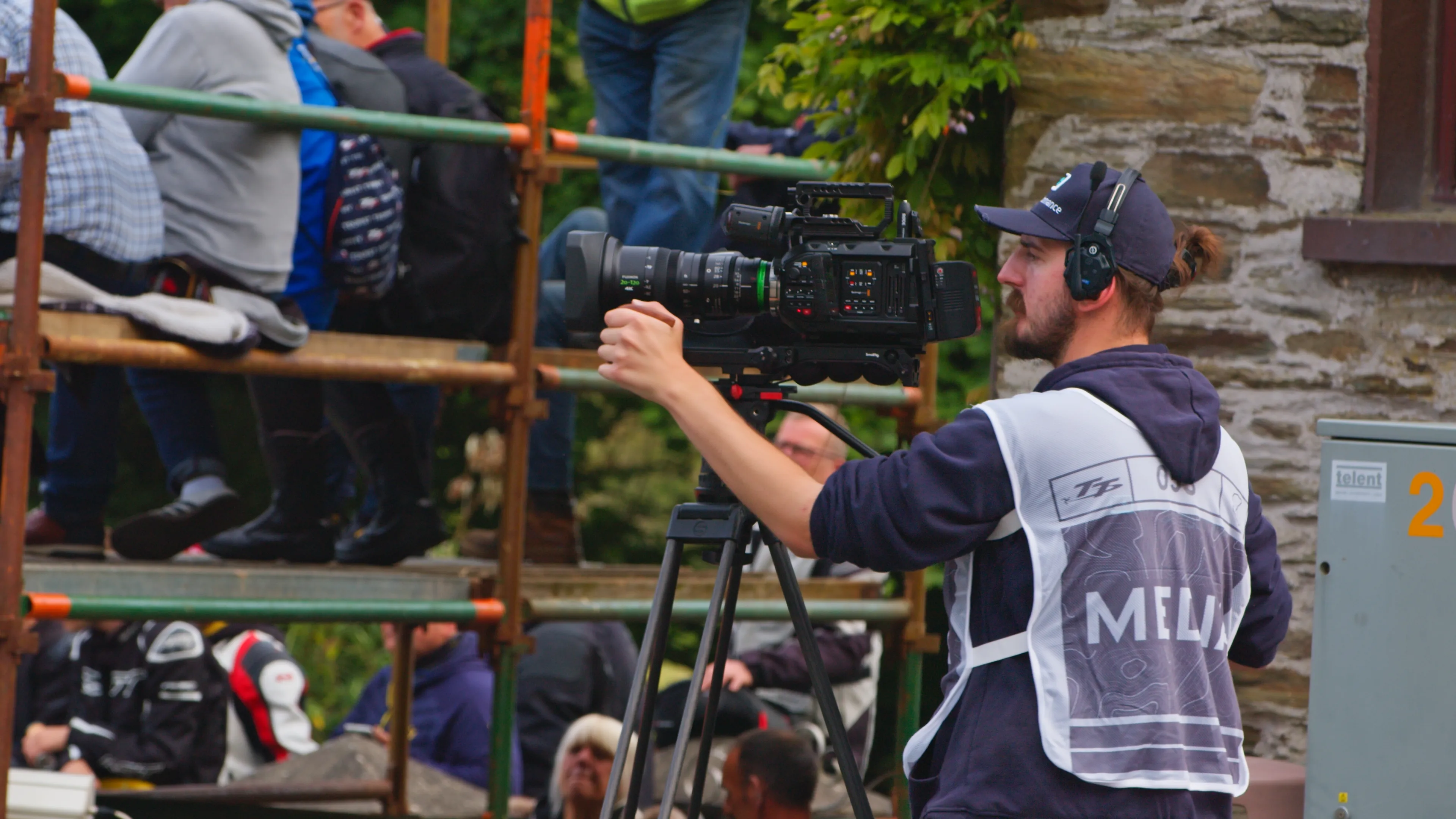 Will Oates films the TT at Ballacraine in Sector 3 using the URSA 12K as TT riders speed past. wearing a white TT approved tabard that allow for closer access to the races.